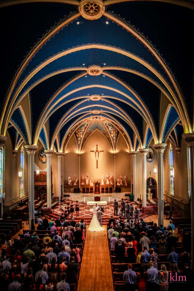 Ceremony in Church With Tall, Grand Ceilings