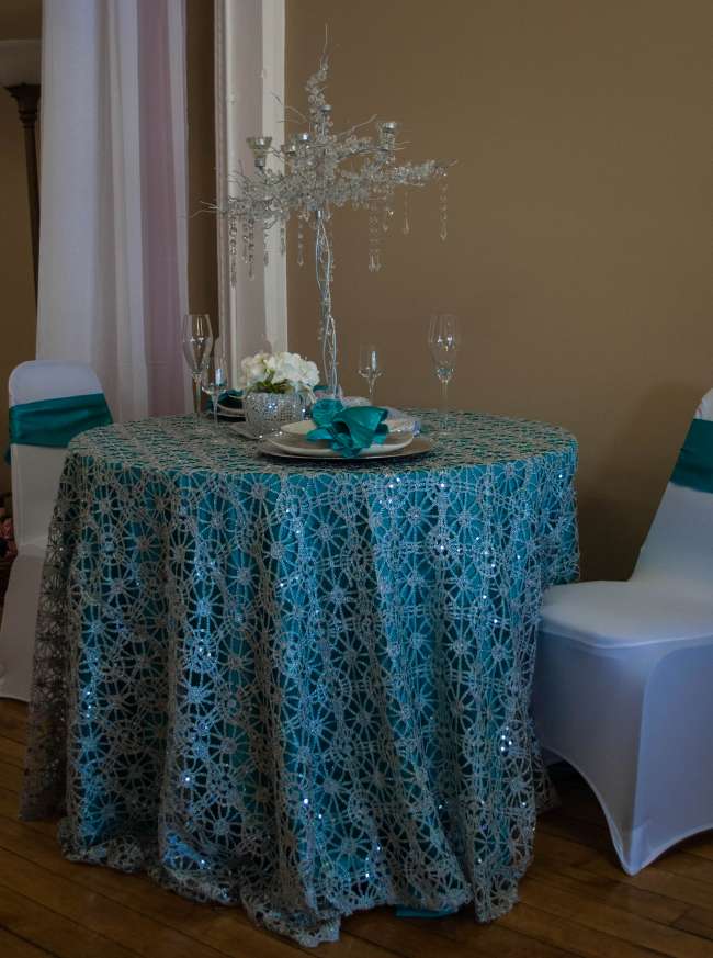 Beautiful sapphire table linens & sparkly centerpiece