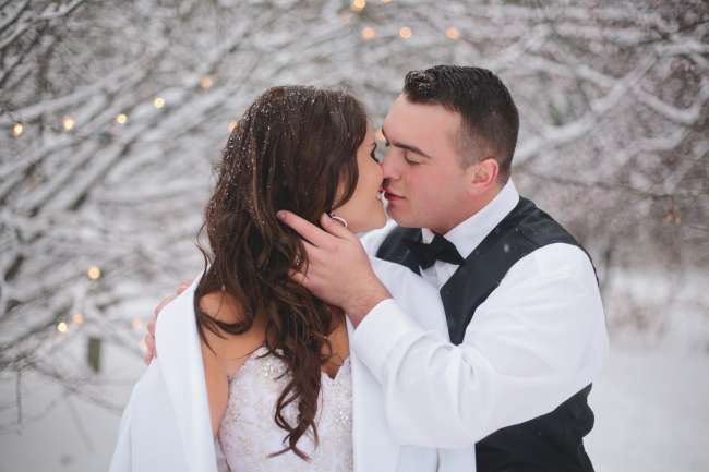 Bride & Groom Kiss in a Winter Wonderland