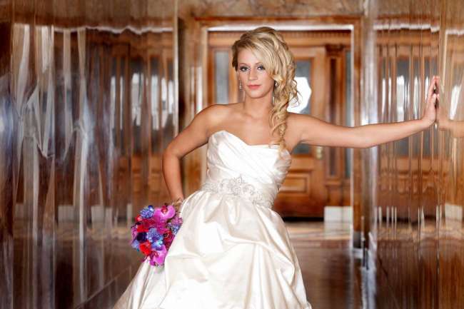 Bride Standing with Purple Bouquet
