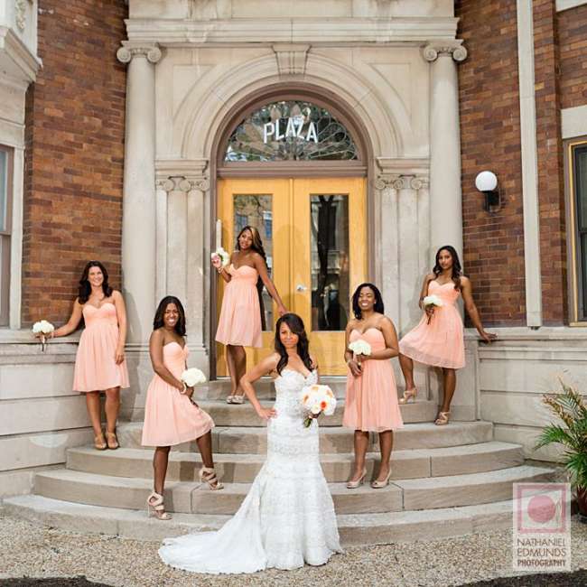 Bride with bridesmaids outside of venue