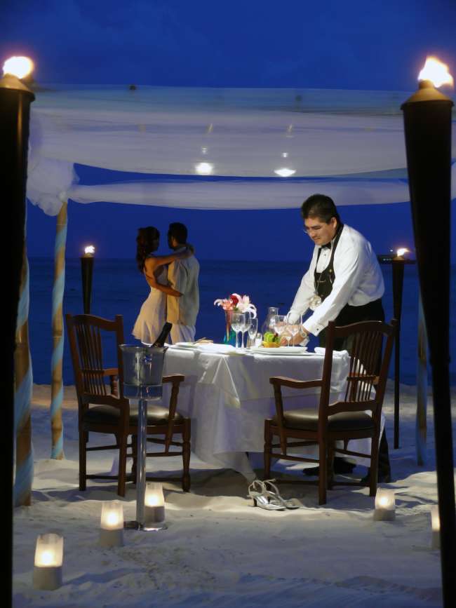 Dinner on the beach by candlelight