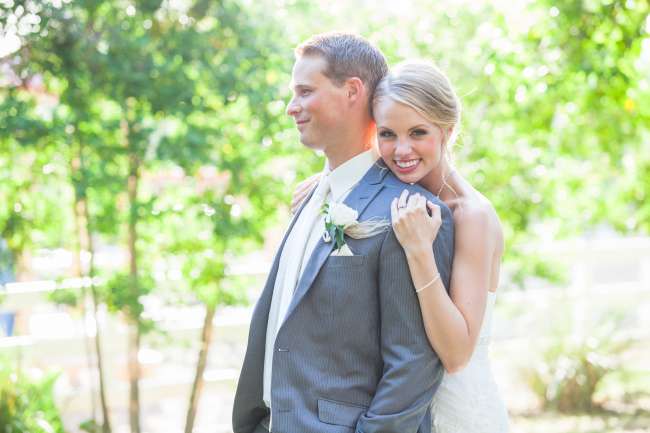 Bride leans on groom's shoulder