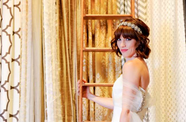 Bride in Front of Ivory & Gold Linens