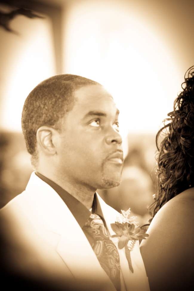 Groom Looks Up During the Ceremony