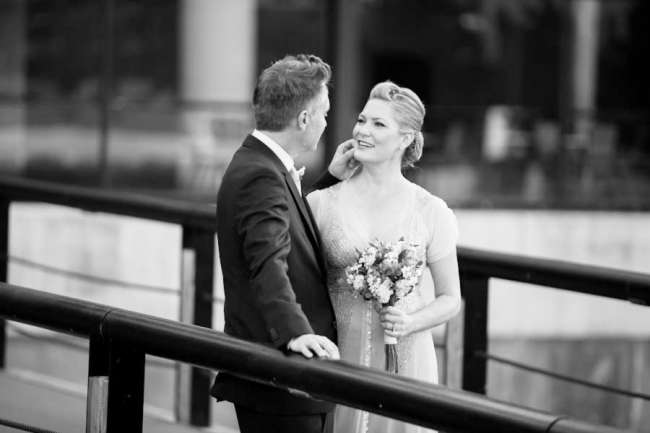 Bride and groom on bridge