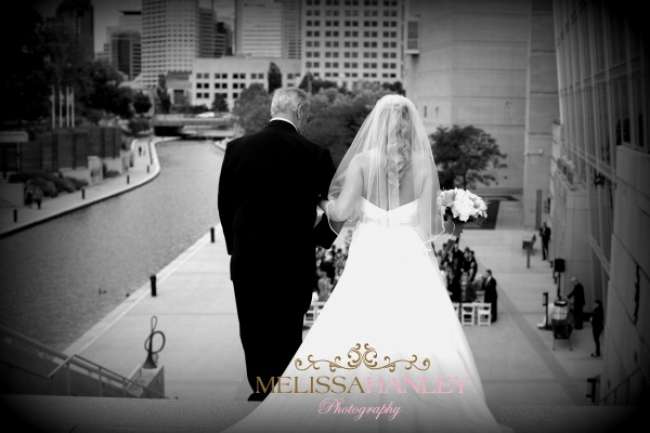 Bride and her father walking down the aisle