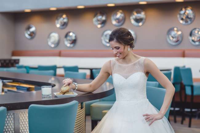 Bride Eating Milk & Cookies at Counter