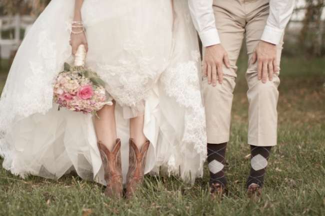 Bride and groom show off shoes