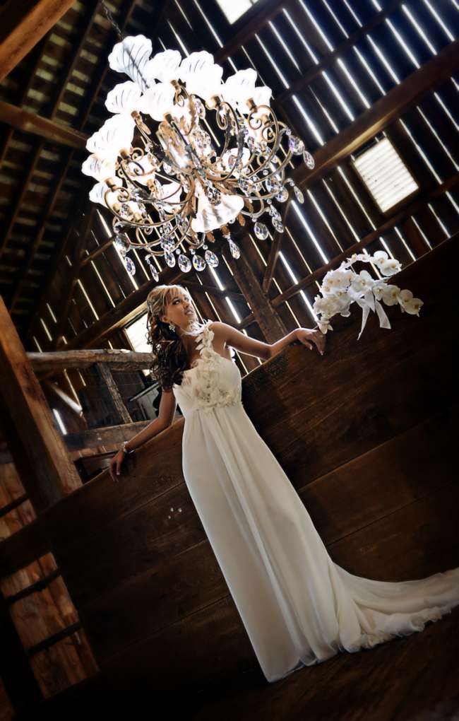 Bride in Front of Chandelier in Barn