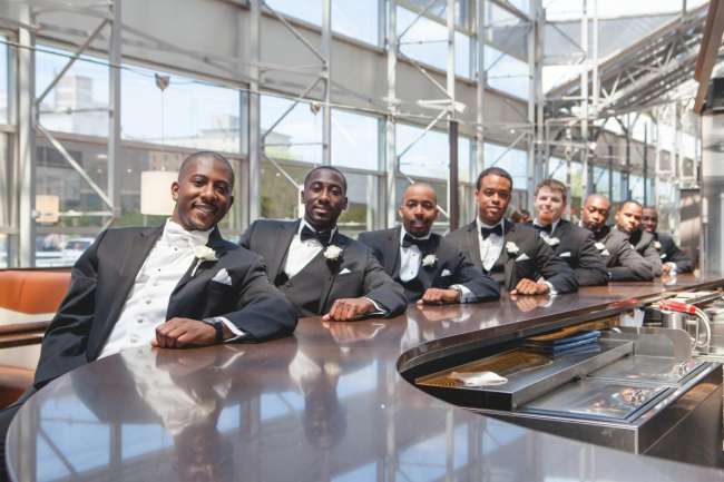 Groom & Groomsmen Sitting at Bar