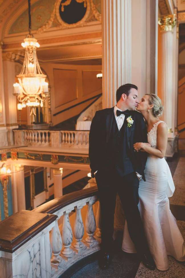 Wedding Couple Kissing in Morris Performing Arts Center Grand Lobby
